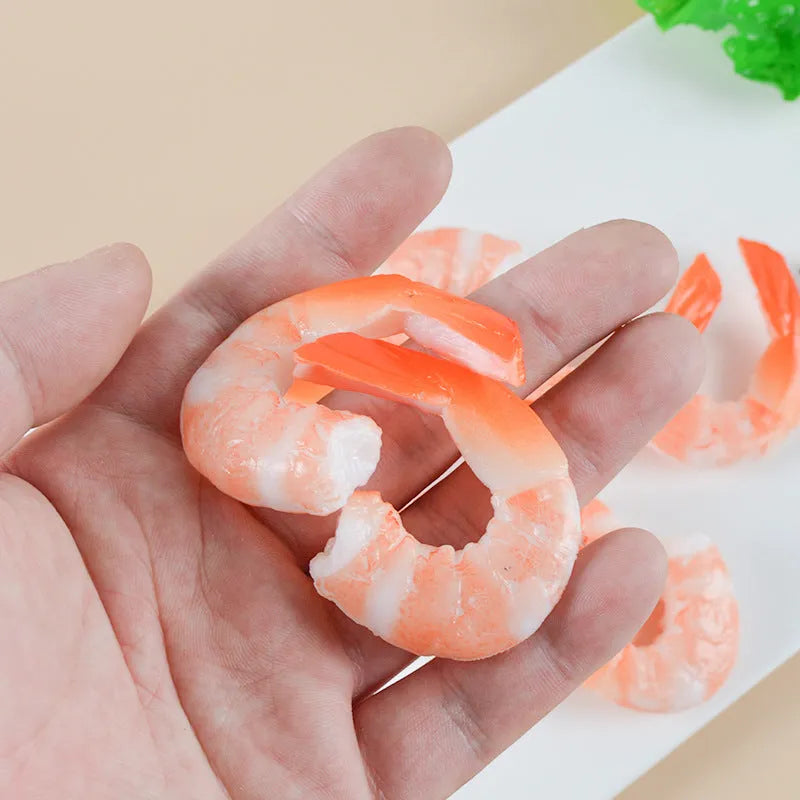 Detailed PVC simulation shrimp keychain bag charm on a white background.