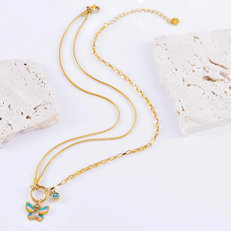 Epoxy butterfly jewellery set with gold colour titanium steel necklace and bracelet