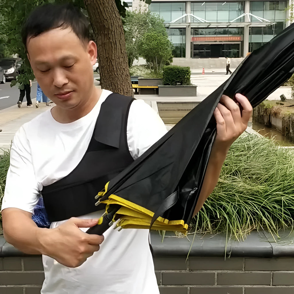 Black portable umbrella holder with a shoulder strap for beach sunshades, shown next to a manual umbrella