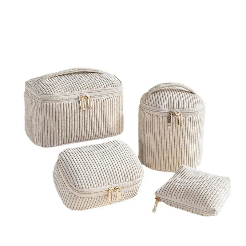 Four cube-style polyester makeup bags in coordinating colours