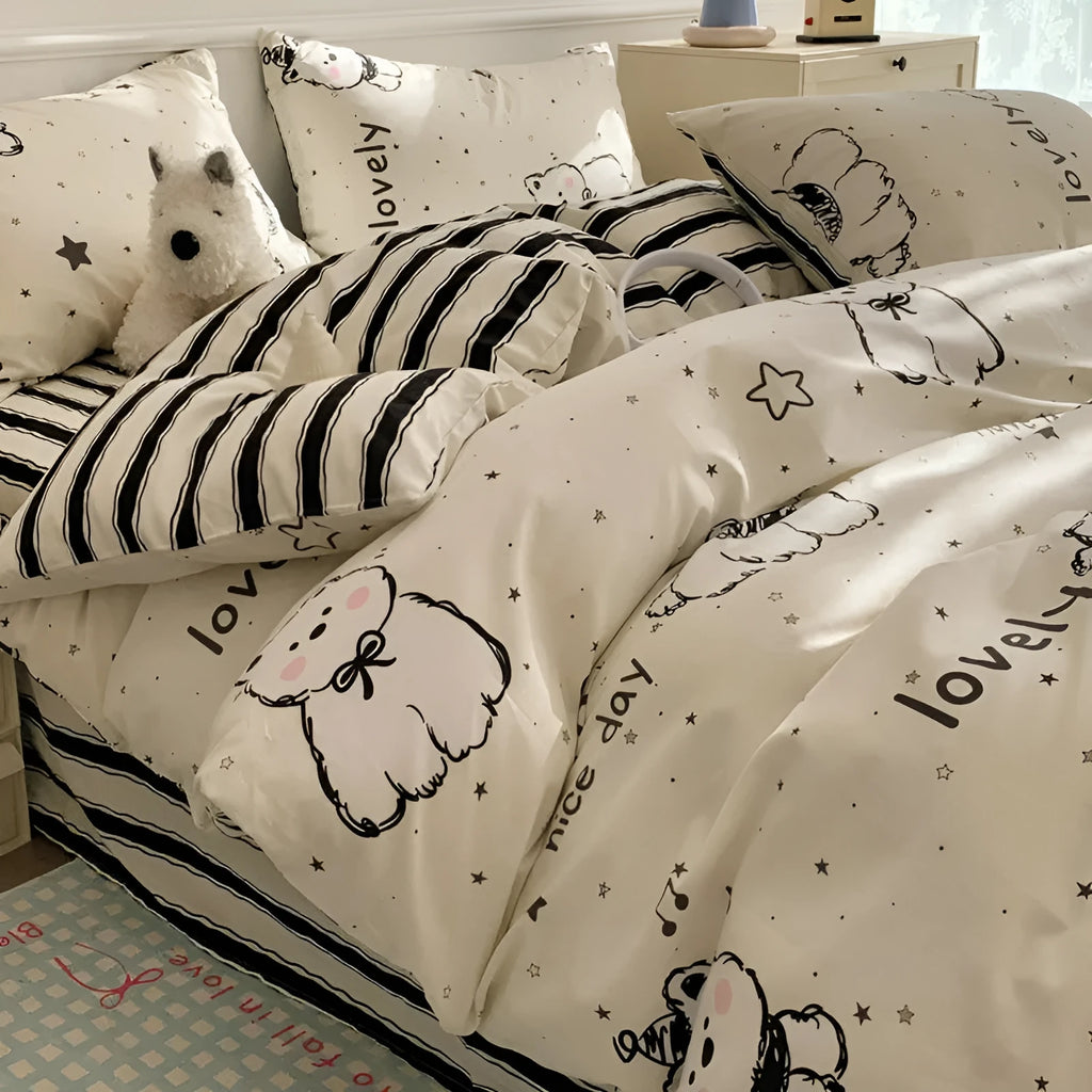 Cartoon dog pattern pure cotton four-piece duvet cover and pillowcase set on a bed.