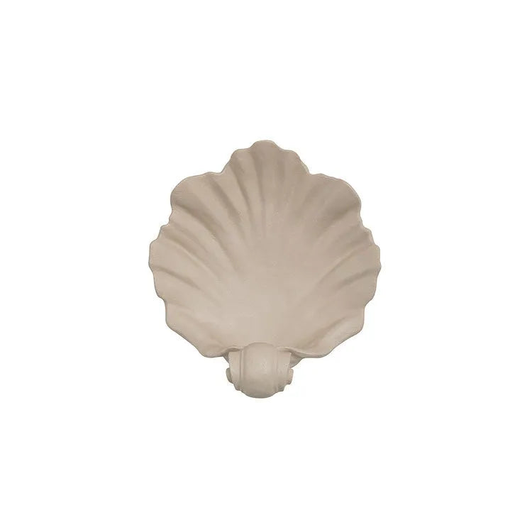 White resin shell-shaped fruit plate ornament on table setting