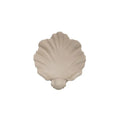 White resin shell-shaped fruit plate ornament on table setting