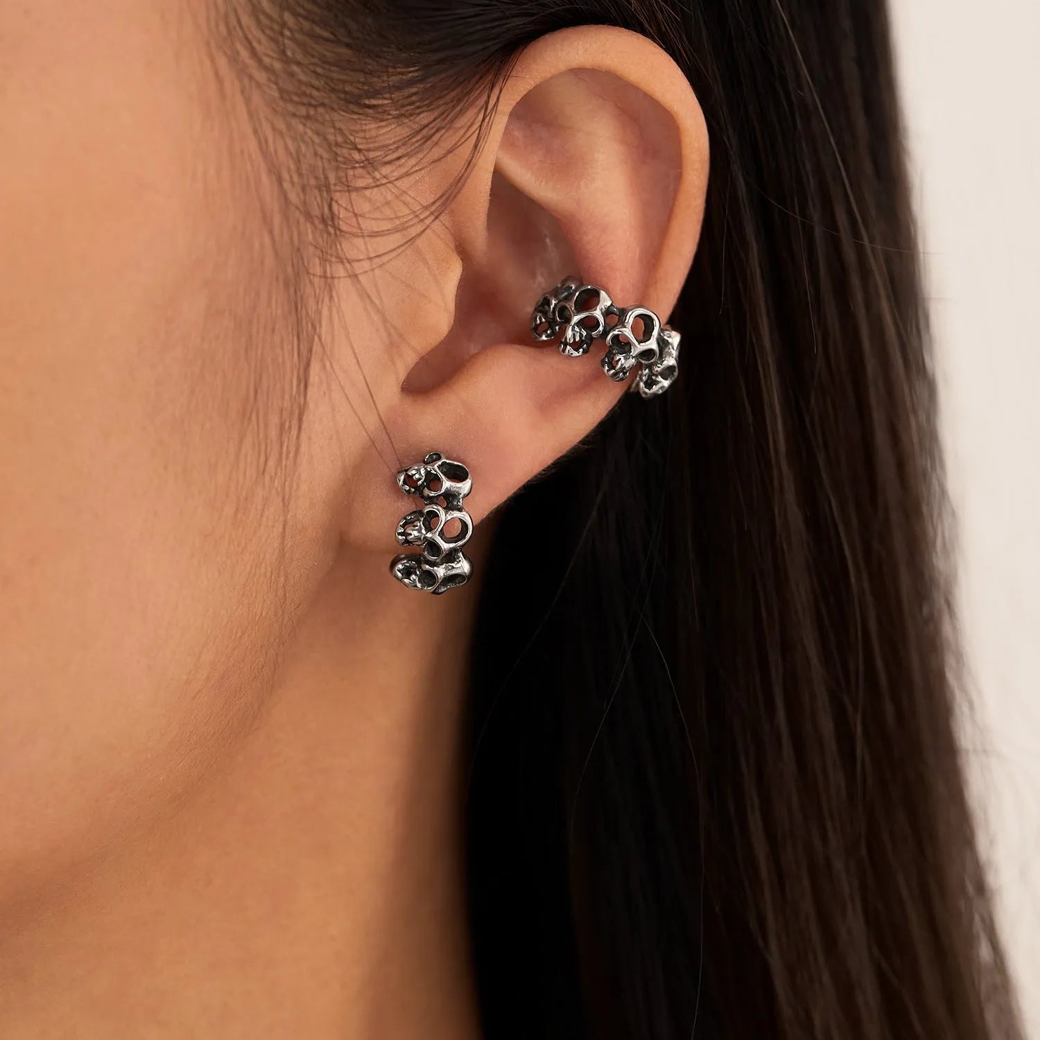 Stainless steel hollow skull design earrings with electroplated GE990-steel ear clips.