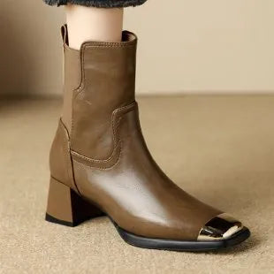 Brown slim-fit women's Martin boots with high heel and side zip on a white background