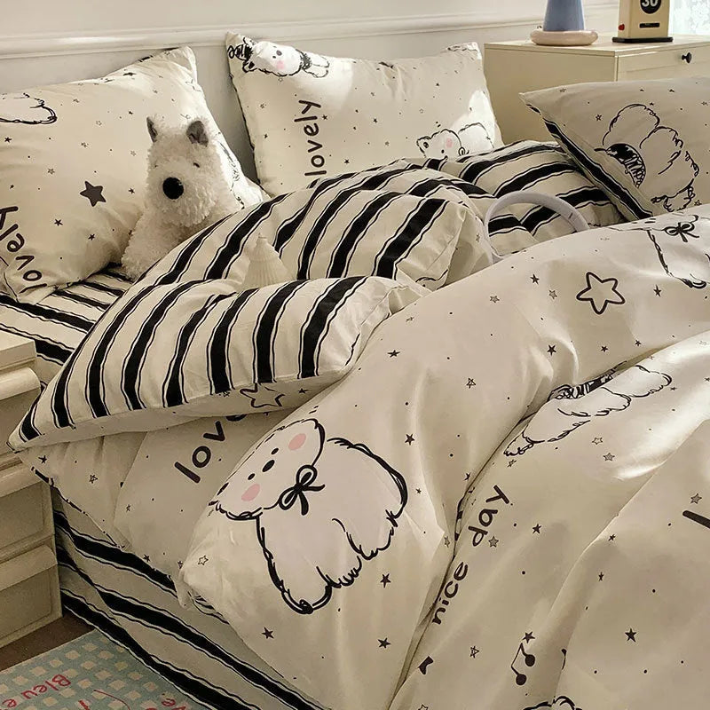 Cartoon dog pattern pure cotton four-piece duvet cover and pillowcase set on a bed.