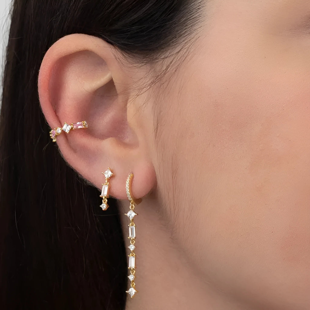 Women's gold-colour geometric U-shape ear clips with micro-inlaid colourful zircon stones and dot-ring-line pattern.
