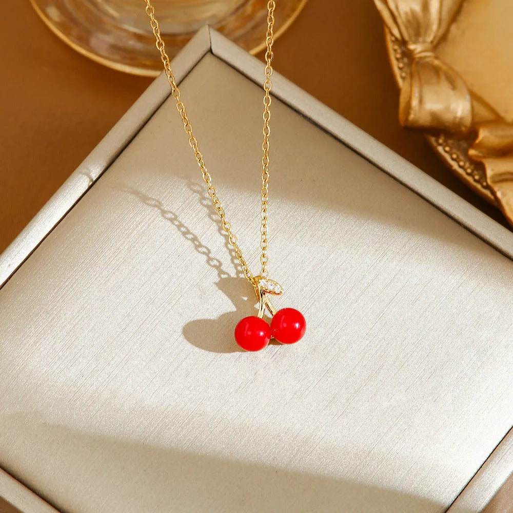 Delicate titanium steel necklace with a small cherry charm on an O-ring chain.