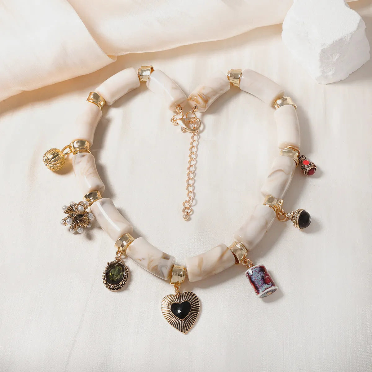 Heart-shaped bamboo resin pendant necklace with electroplated metallic finish