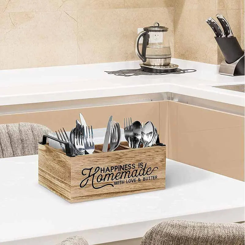 Wooden kitchen tableware storage box with grid dividers showing utensils organised in compartments