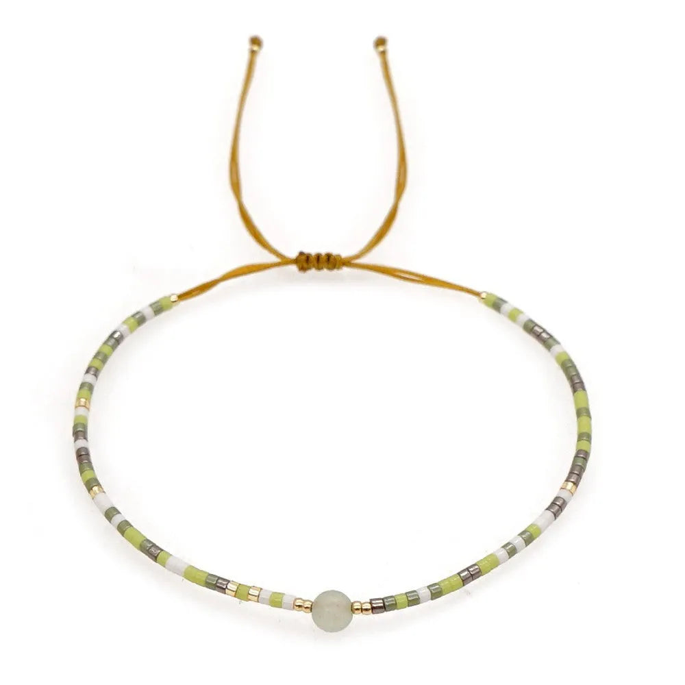 Handmade bohemian-style bracelet with colourful geometric glass beads for women.