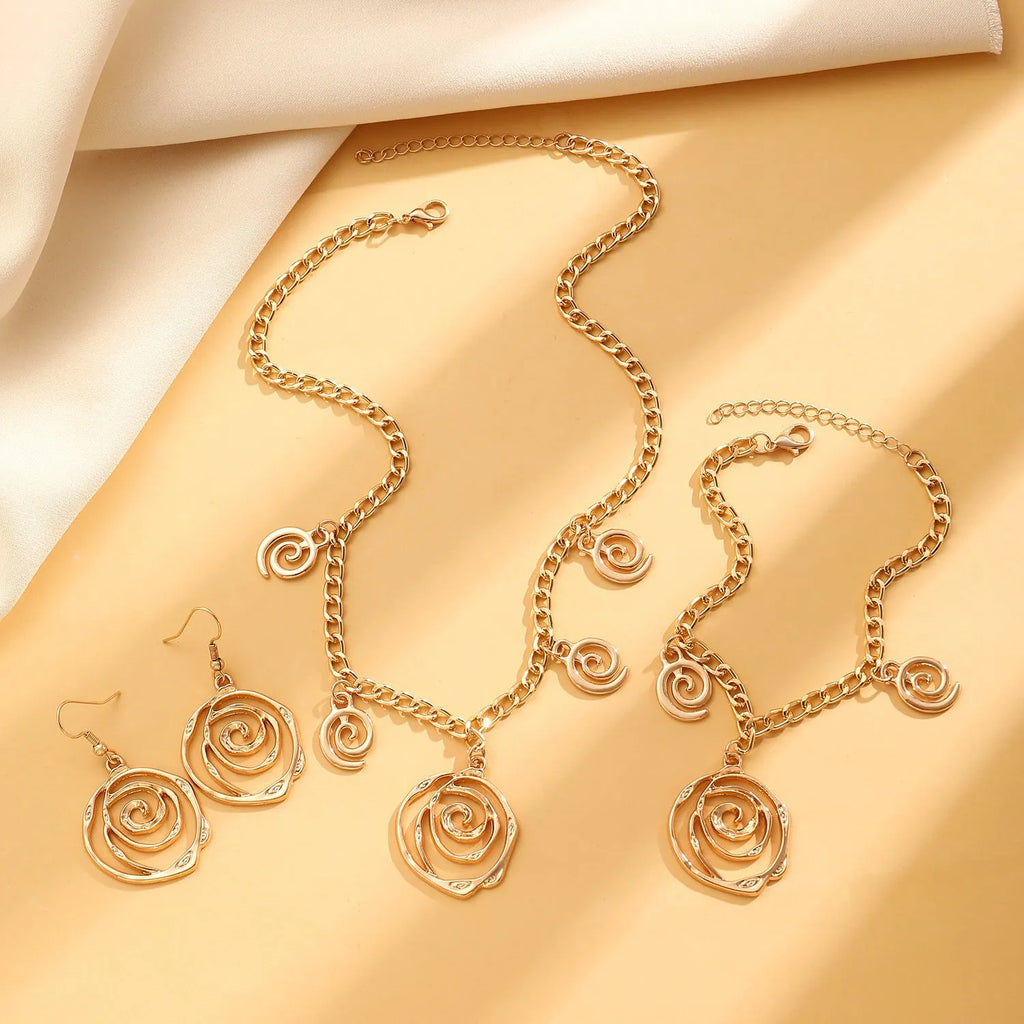 Geometric spiral donut jewellery set with necklace, bracelet, and earrings on adjustable 41-50cm chain