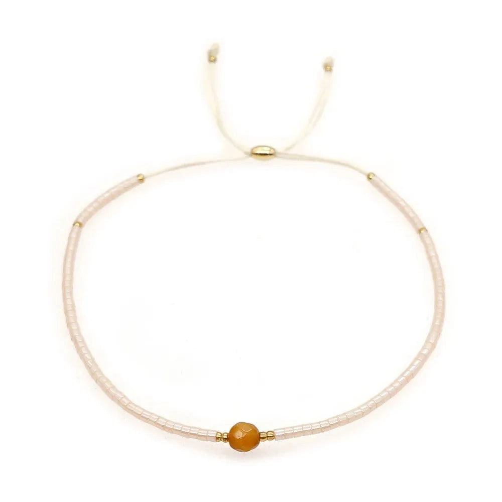 Handmade bohemian-style bracelet with colourful geometric glass beads for women.