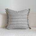 Coffee brown striped Chinese classical style pillow cushion on a sofa, shown in both square and waist pillow sizes.