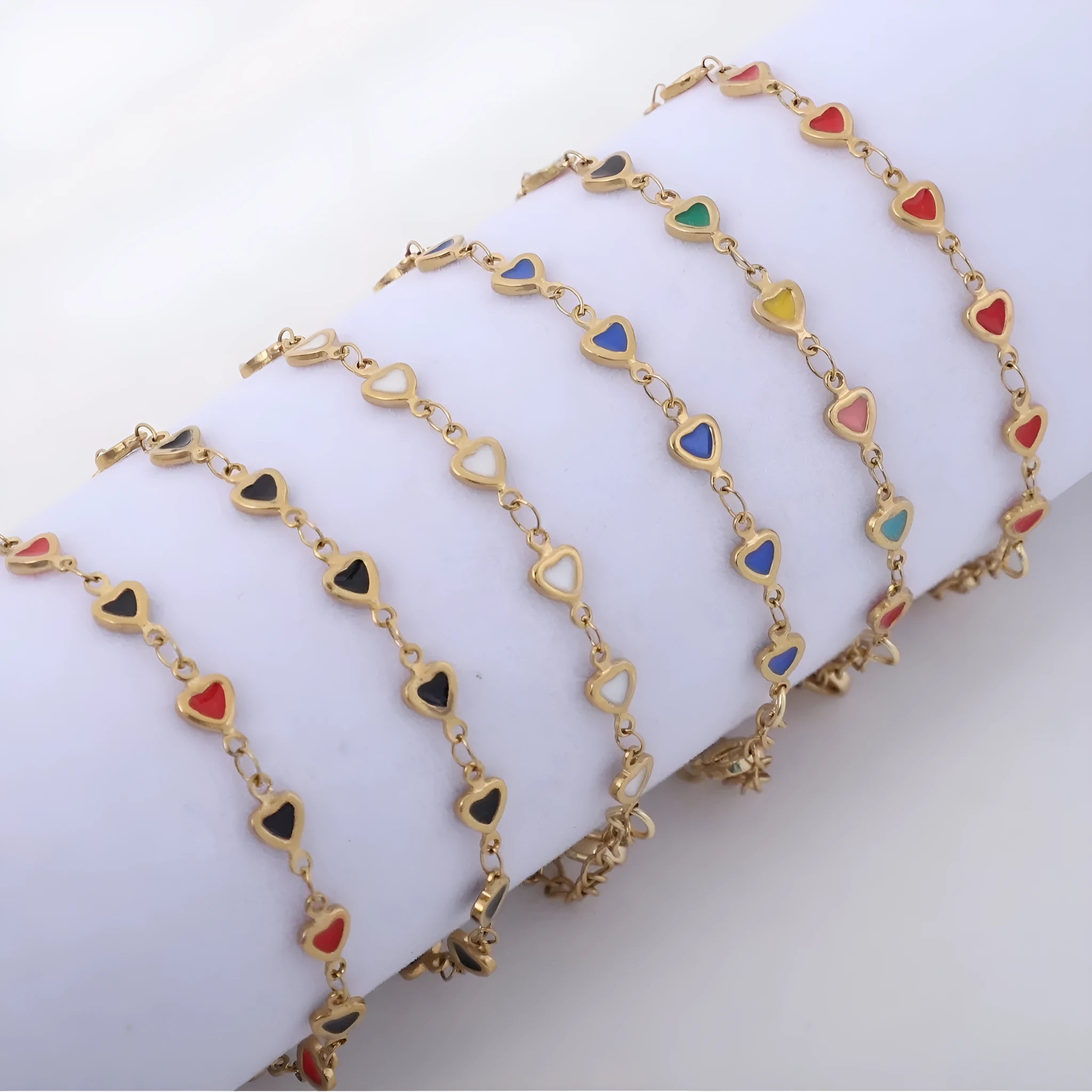 Adjustable stainless steel bracelet with heart symbol in multiple colour options showing 17+5cm length