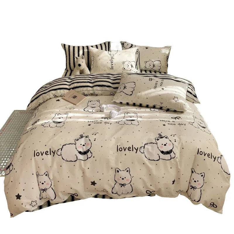 Cartoon dog pattern pure cotton four-piece duvet cover and pillowcase set on a bed.