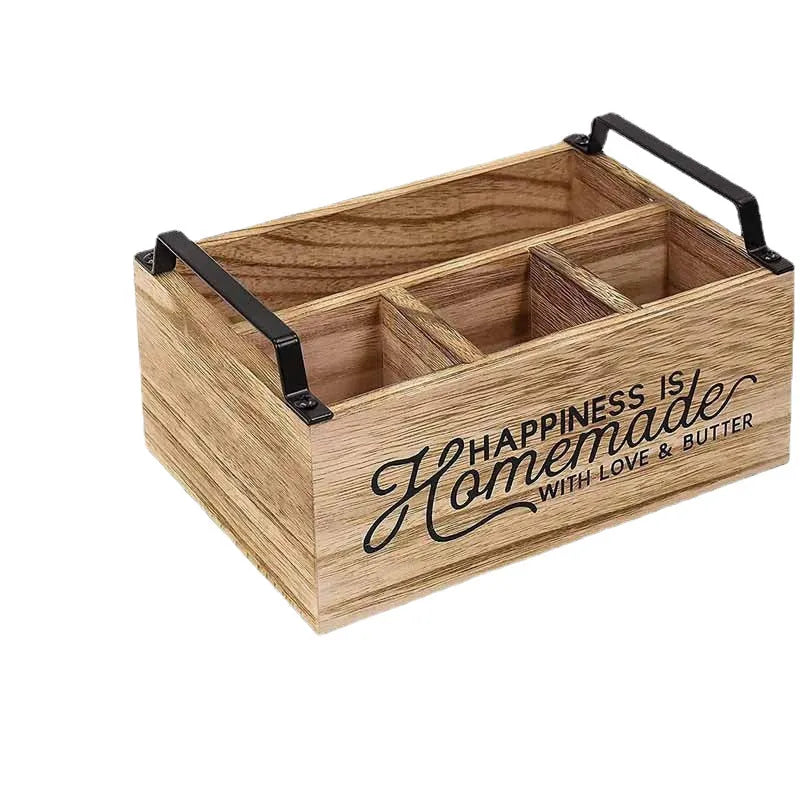 Wooden kitchen tableware storage box with grid dividers showing utensils organised in compartments