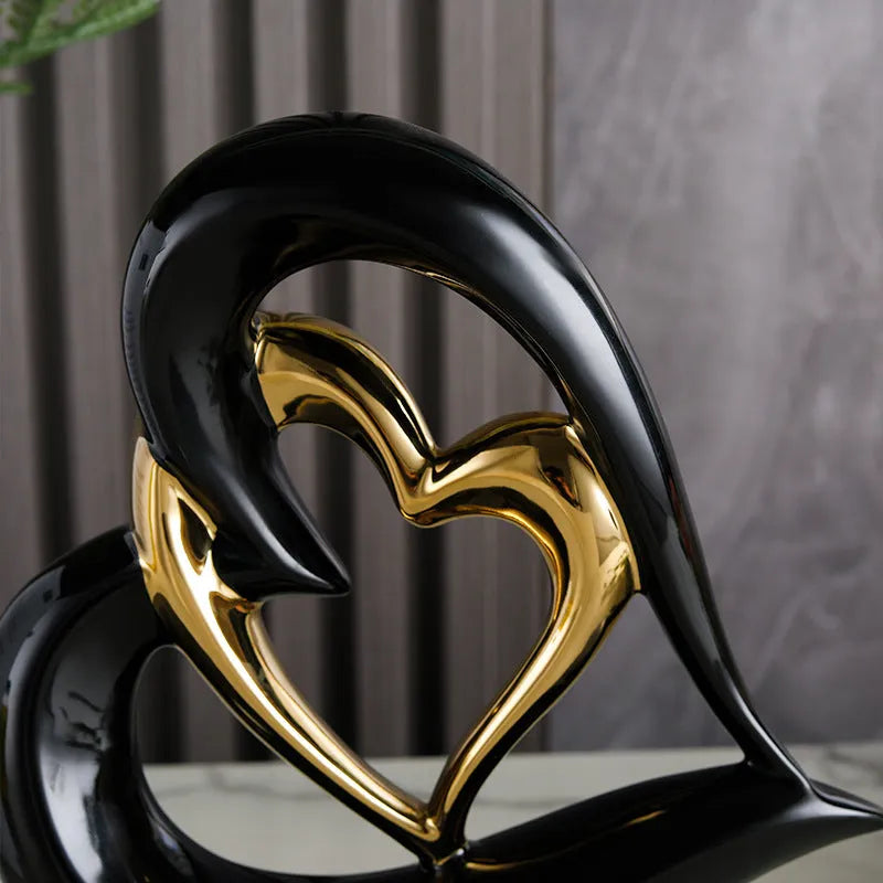 Modern geometric love heart ornament in white porcelain with metallic finish on display surface