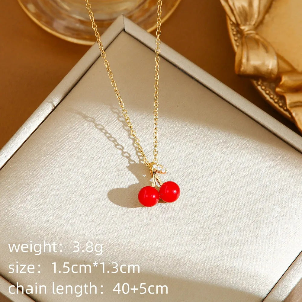 Delicate titanium steel necklace with a small cherry charm on an O-ring chain.