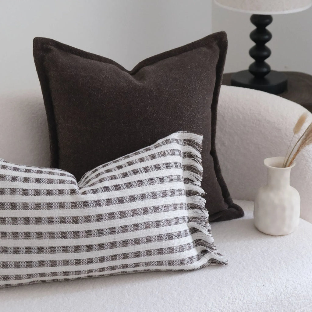 Coffee brown striped Chinese classical style pillow cushion on a sofa, shown in both square and waist pillow sizes.