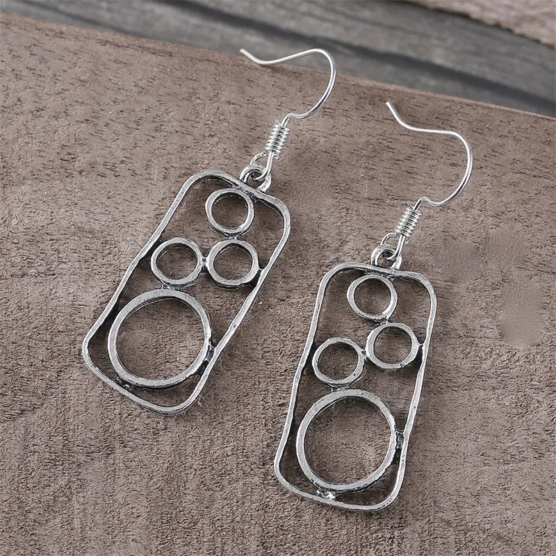 Geometric irregular square zinc alloy earrings with antique silver finish.