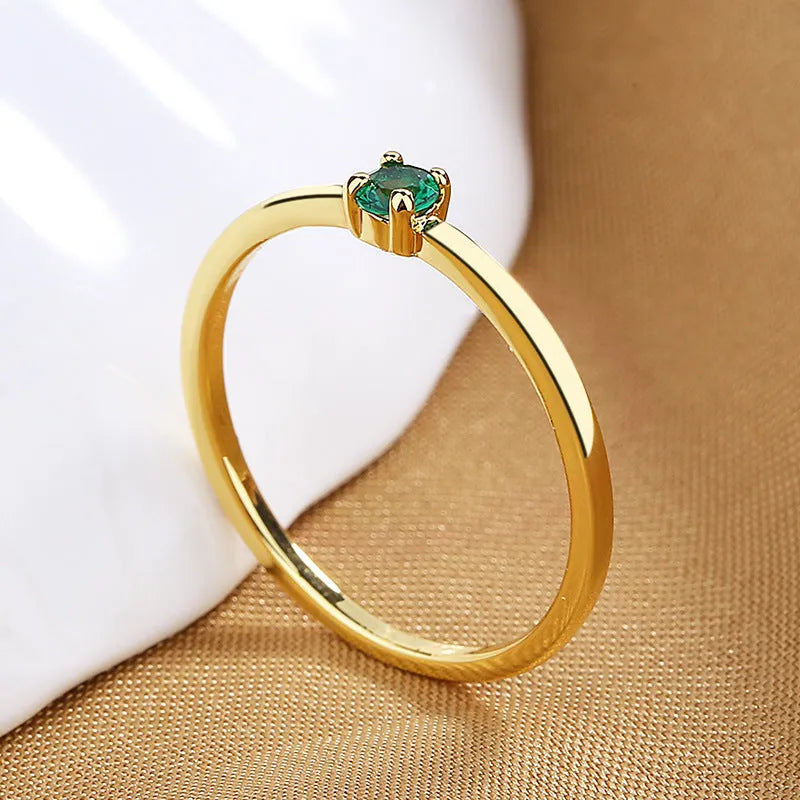 Copper geometric circle ring for women with a single diamond detail, shown in multiple colour options.