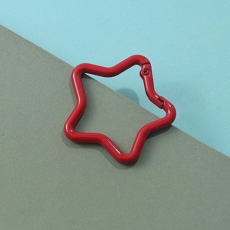 Zinc alloy five-pointed star keychain in a choice of macaron colours for bag decoration.