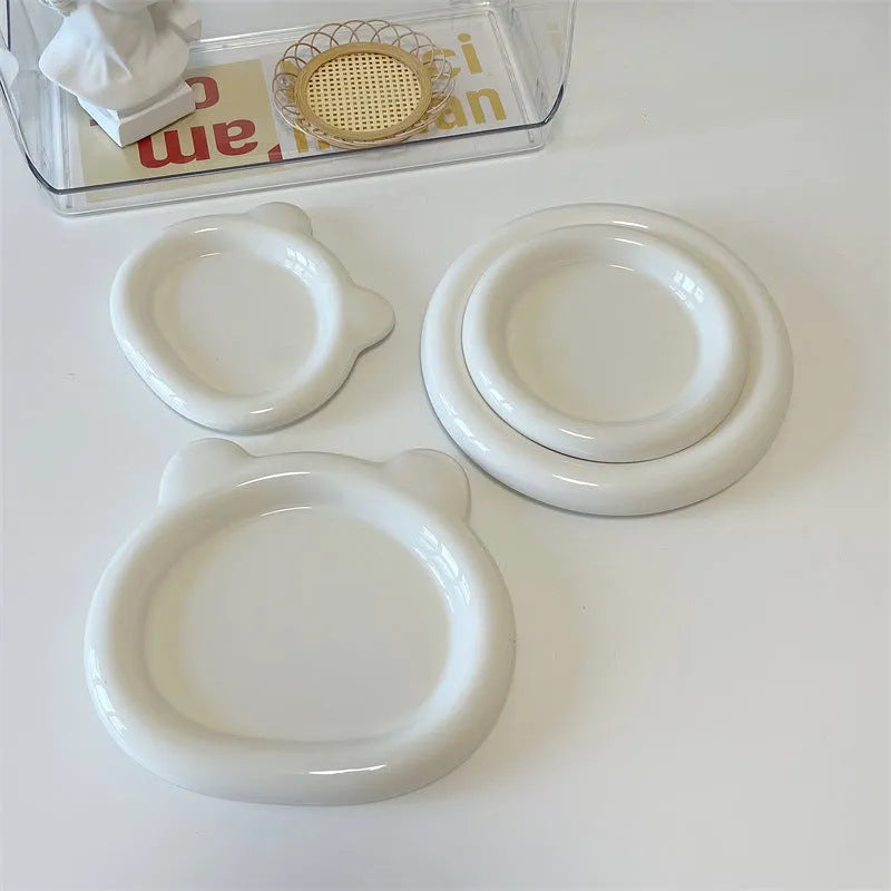 White ceramic plate with doodle design showing bear pattern, suitable for microwave use
