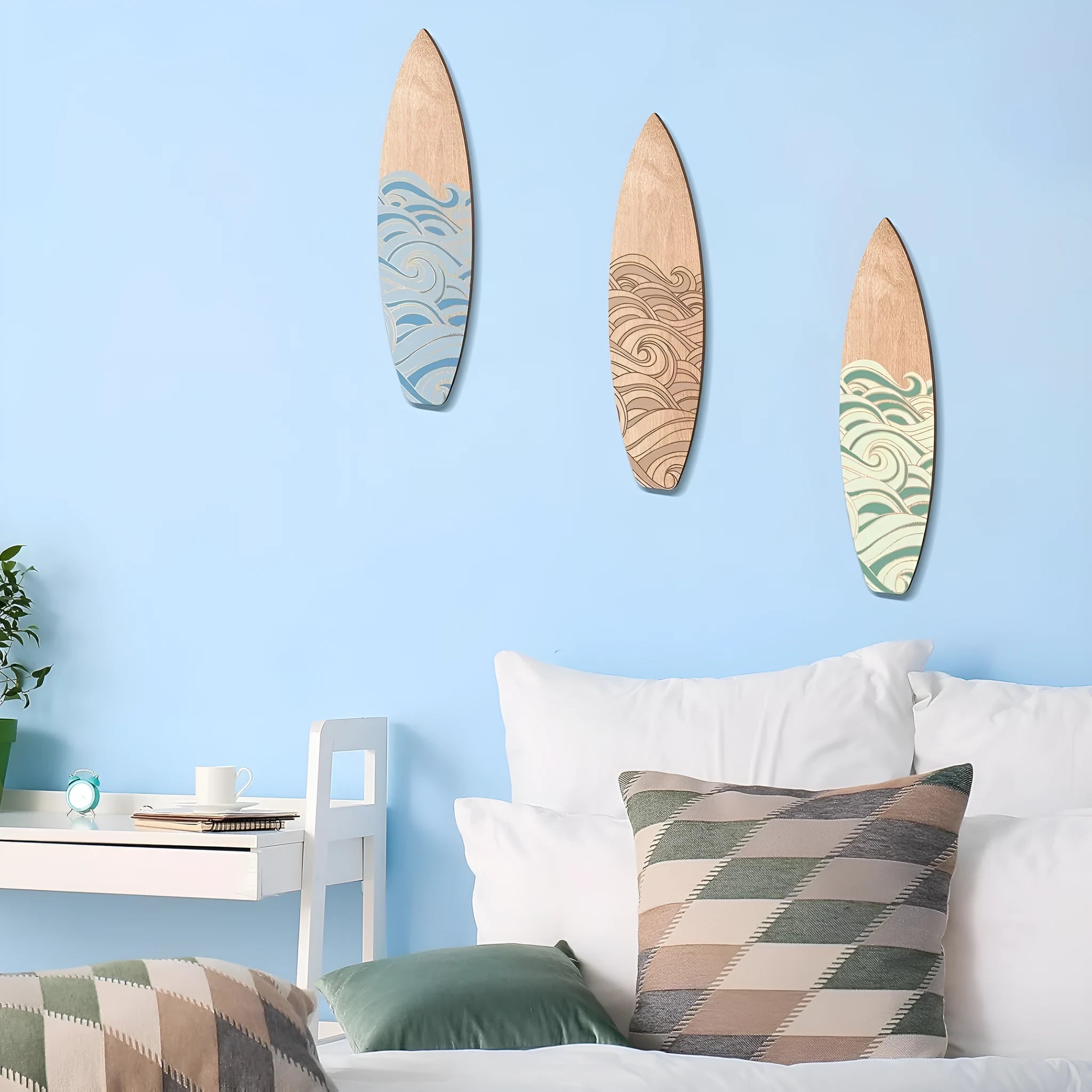 Three identical wooden surfboard-shaped wall decorations made from boxwood, shown against a plain background