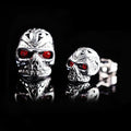 Retro skull stud earrings with red eye detailing and electroplated alloy construction
