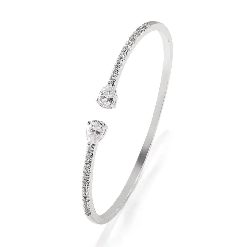 Copper bracelet with inlaid zircon treatment in blue and white colour options