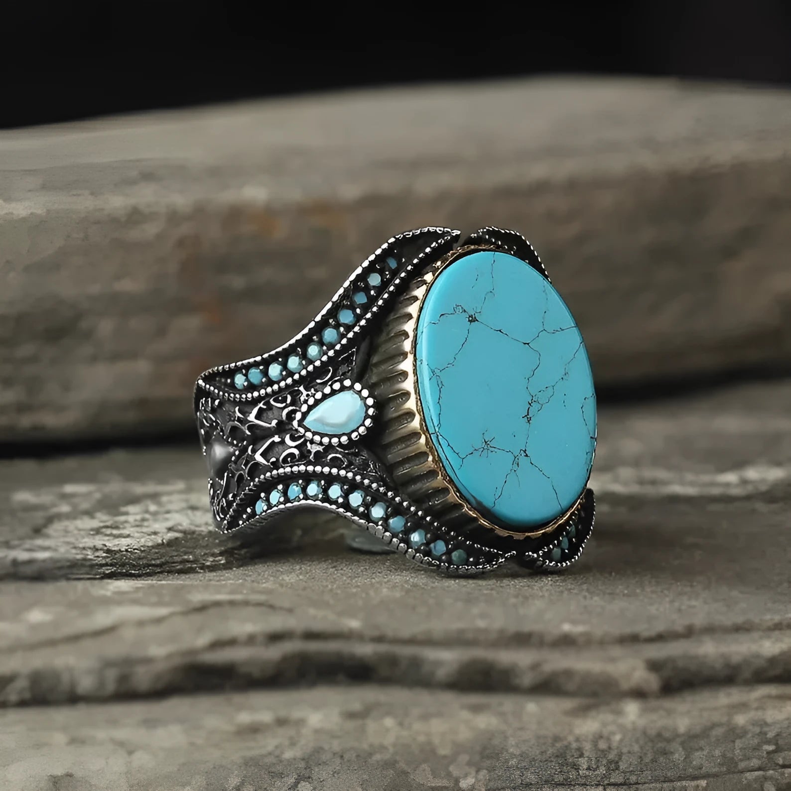 Men's antique silver alloy ring with turquoise accent on finger, showing round shape and simple design