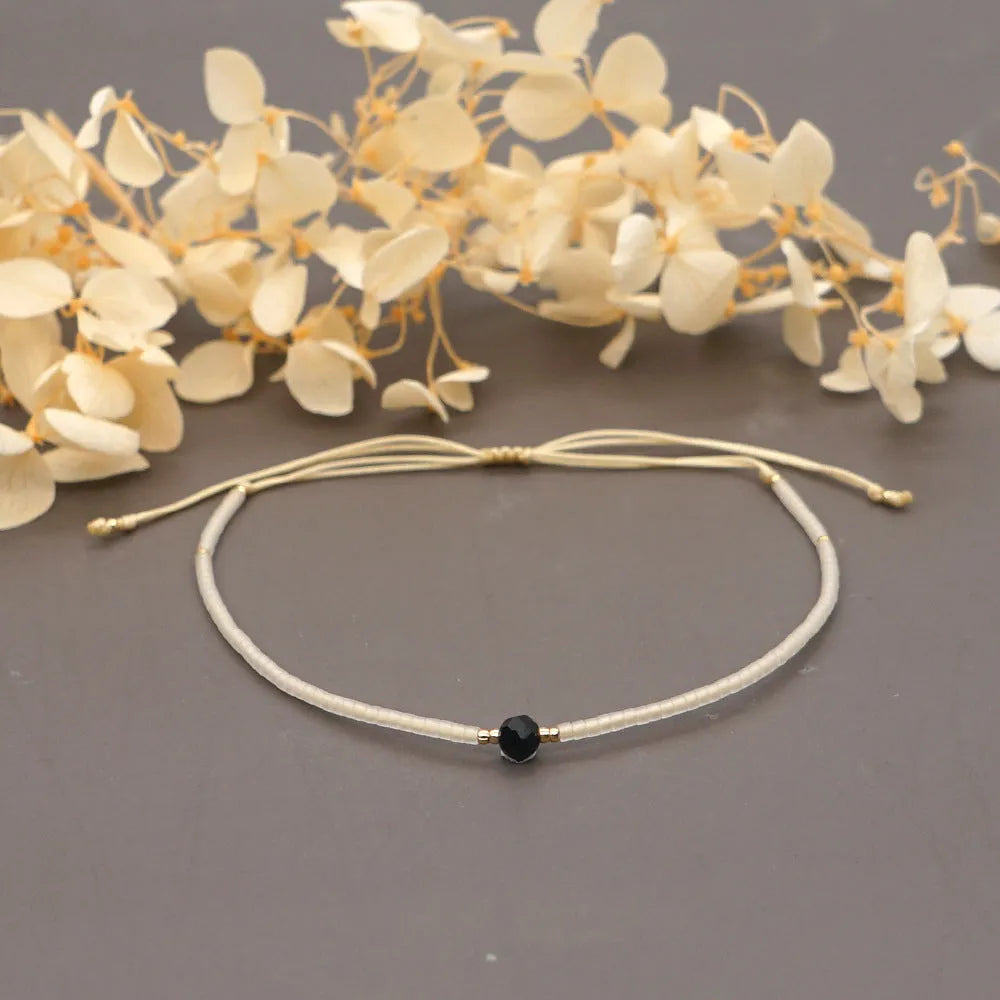 Handmade bohemian-style bracelet with colourful geometric glass beads for women.