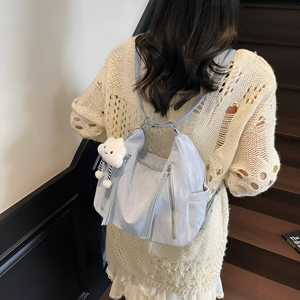 Women's soft PU fashion backpack in black with pendant accessory