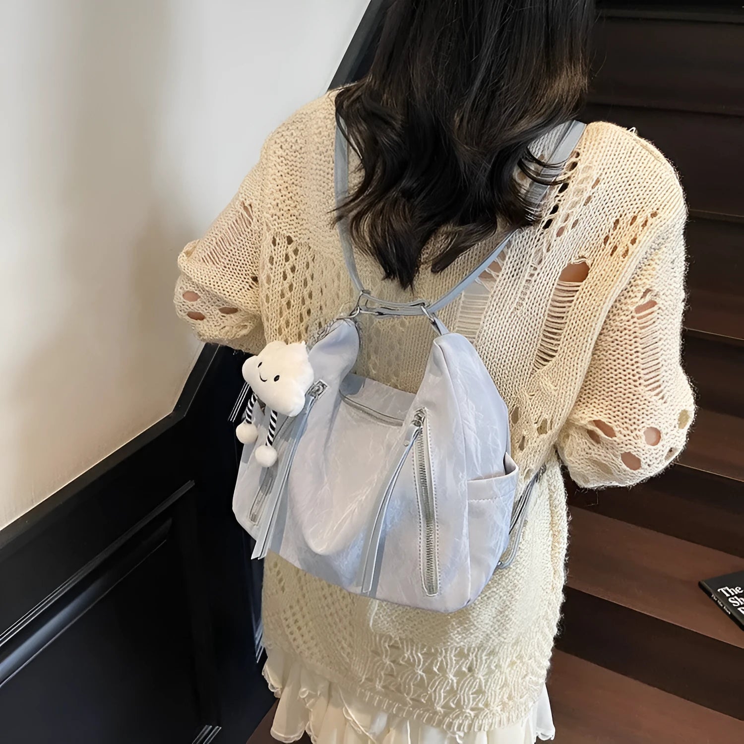 Women's soft PU fashion backpack in black with pendant accessory