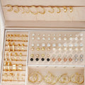 108 gold and yellow alloy geometric earrings with round pearl-like elements arranged in bulk set