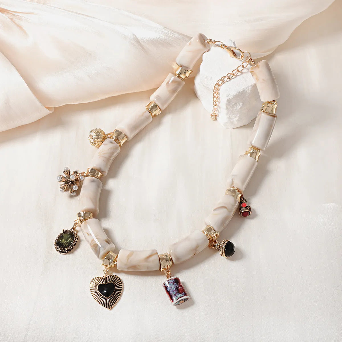 Heart-shaped bamboo resin pendant necklace with electroplated metallic finish