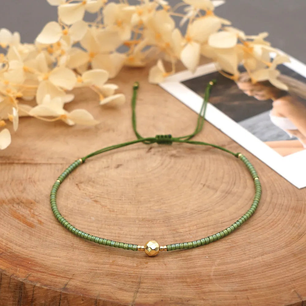 Handmade bohemian-style bracelet with colourful geometric glass beads for women.