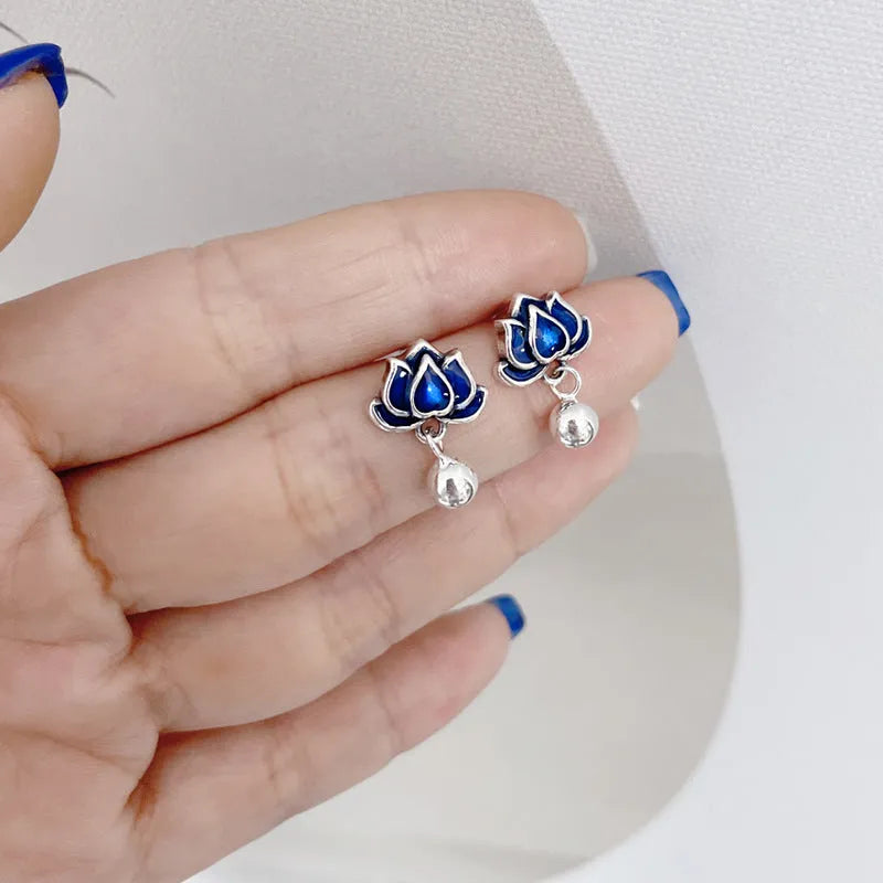 A pair of blue lotus flower alloy ear studs with a retro tassel design.