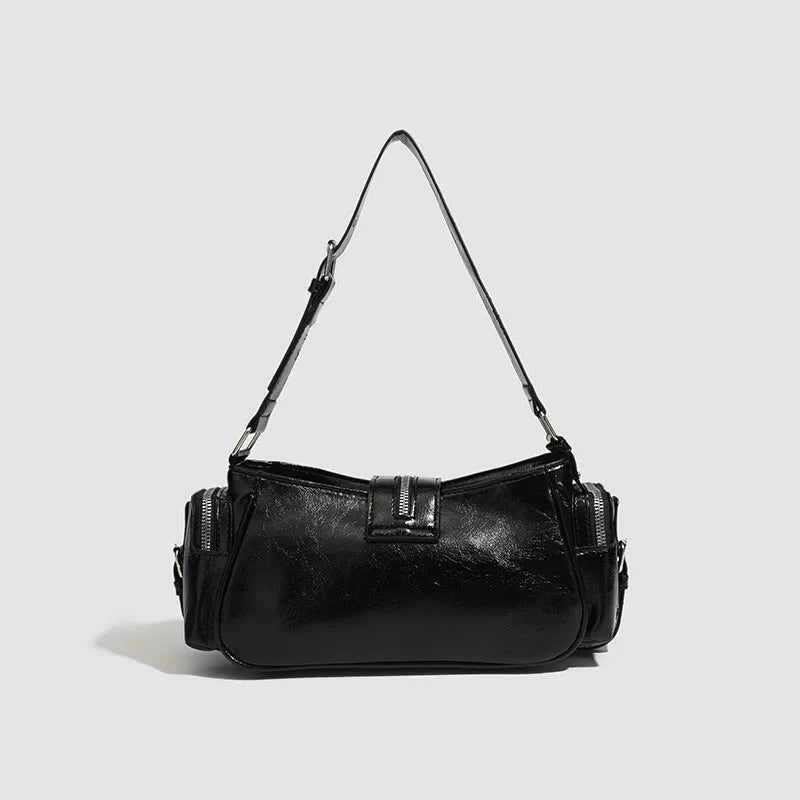 Black retro dumpling-shaped women's shoulder handbag in oil wax PU leather with external pocket.