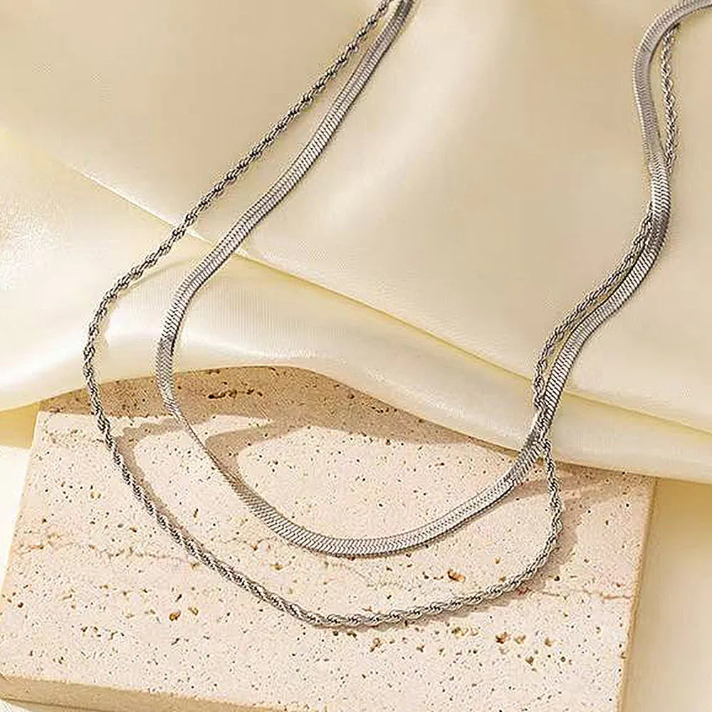 Women's retro geometric double-layer twist necklace in silver or gold tone on adjustable snake bones chain.