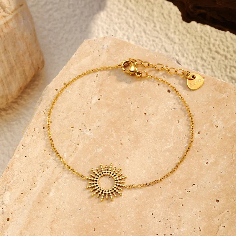 Sunflower Series 14K gold-plated jewellery set showing matching necklace and bracelet with geometric design