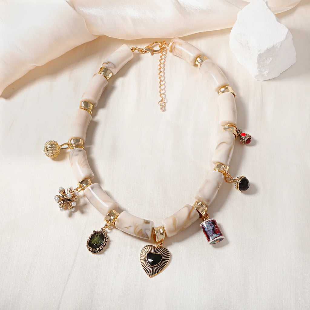 Heart-shaped bamboo resin pendant necklace with electroplated metallic finish