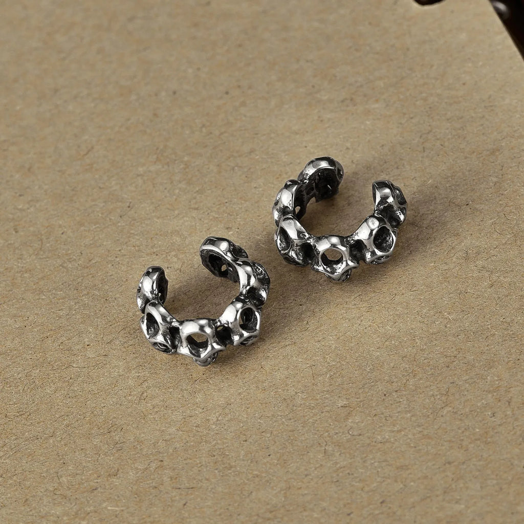 Stainless steel hollow skull design earrings with electroplated GE990-steel ear clips.