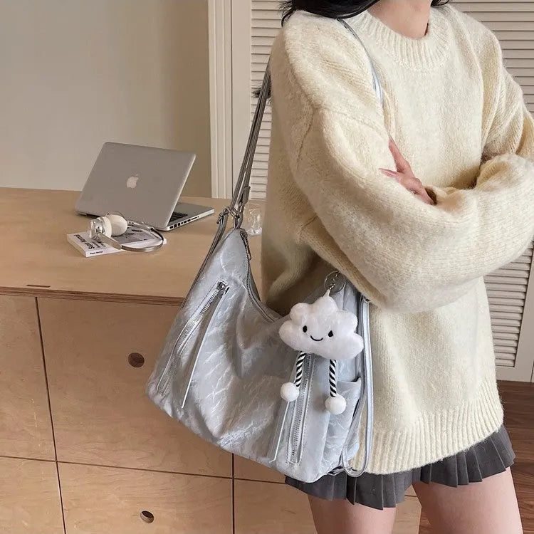 Women's soft PU fashion backpack in black with pendant accessory