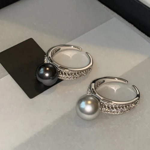 Adjustable black pearl copper ring with geometric open design for women