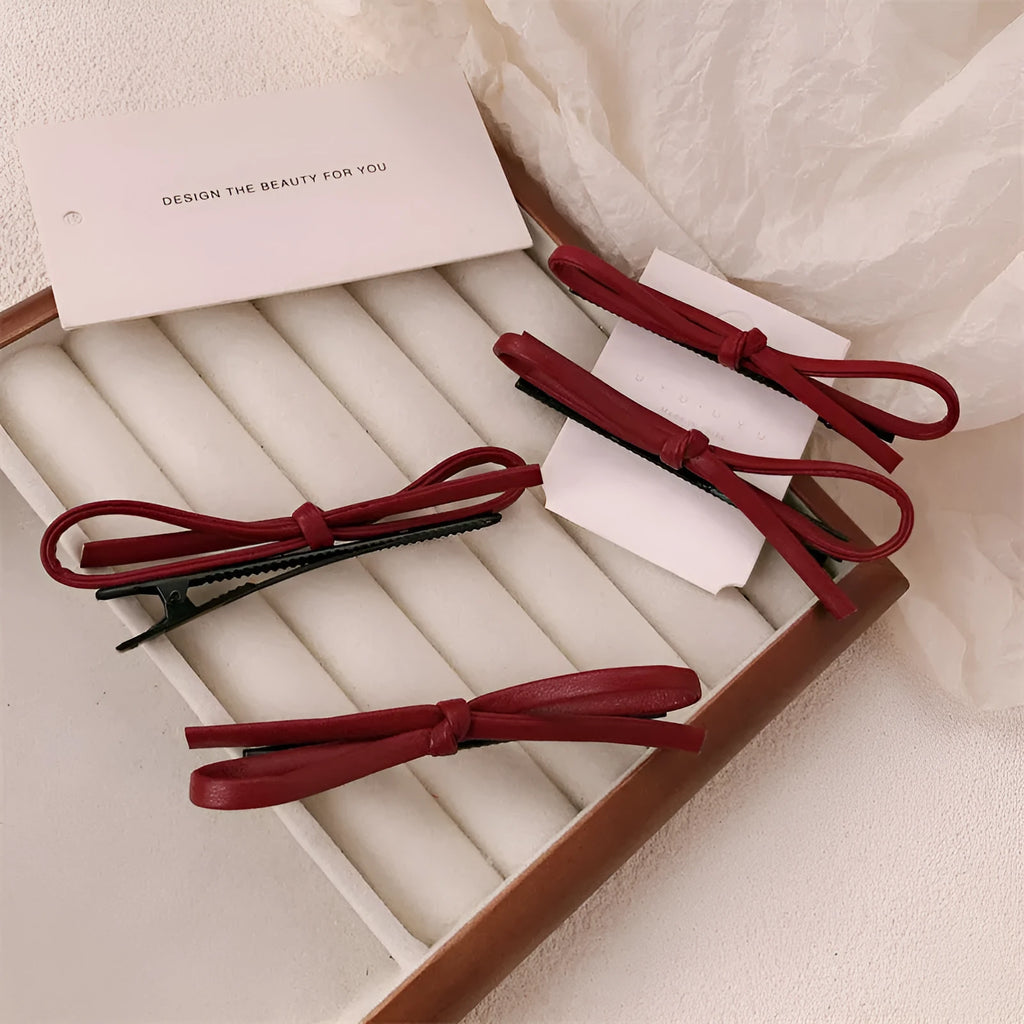 Wine red leather bow hair clip barrette showing advanced bow design and clip mechanism