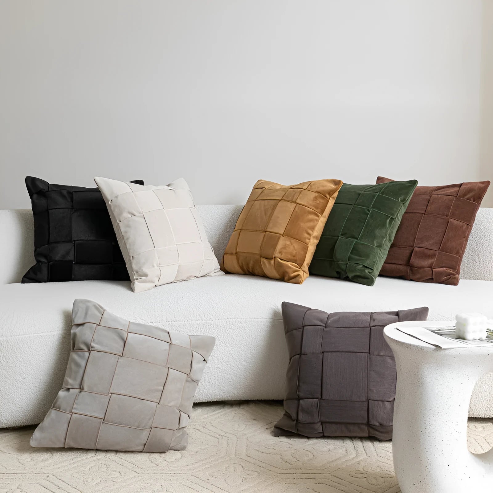 Square chenille woven cushion in beige colour on a grey sofa, 50x50cm size.