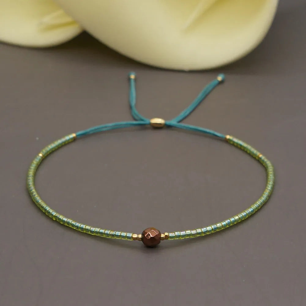 Handmade bohemian-style bracelet with colourful geometric glass beads for women.