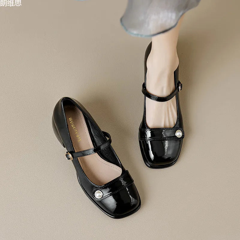Plus size women's chunky heel pumps in patent leather with a square toe and front buckle, shown in apricot colour.